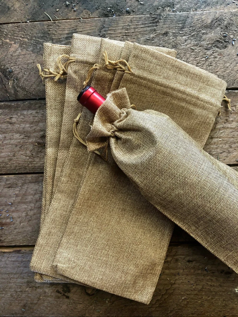 25-burlap-wine-bottle-gift-bags-with-drawstring-jute-wine-bag-6-x14.webp (25) Burlap Wine Bottle Gift Bags with Drawstring (Jute Wine Bag) - 6"x14"